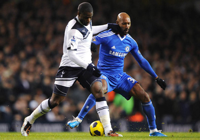 Sebastien Bassong of Tottenham battles for the ball with Nicolas Anelka of Chelsea